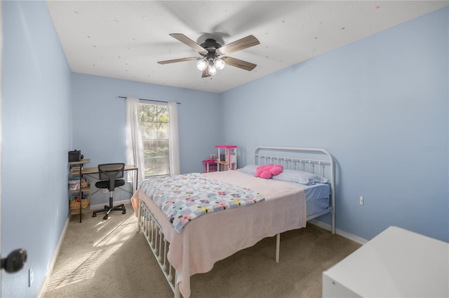 bedroom featuring ceiling fan and light colored carpet