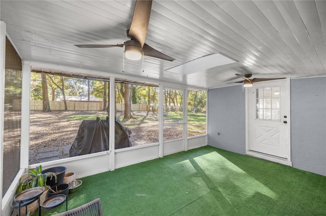 unfurnished sunroom featuring wooden ceiling and a healthy amount of sunlight