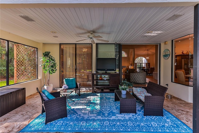 sunroom with wooden ceiling and ceiling fan