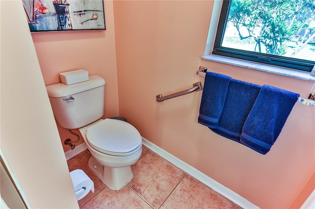 bathroom featuring tile patterned floors and toilet