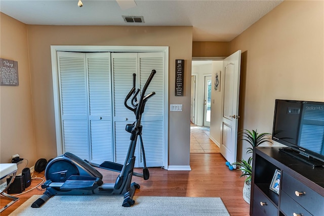 exercise area with wood-type flooring