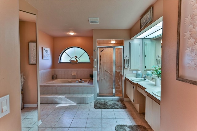 bathroom with vanity, shower with separate bathtub, and tile patterned flooring