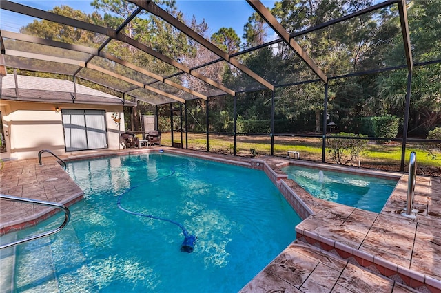 view of pool with a patio and glass enclosure