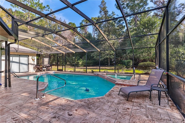 view of swimming pool featuring an in ground hot tub, glass enclosure, and a patio area