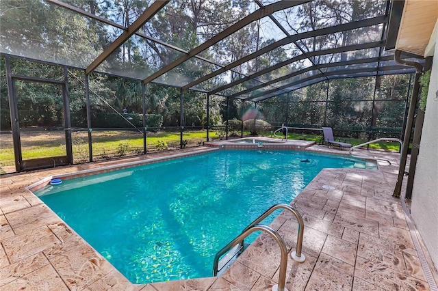 view of swimming pool with an in ground hot tub, glass enclosure, and a patio area