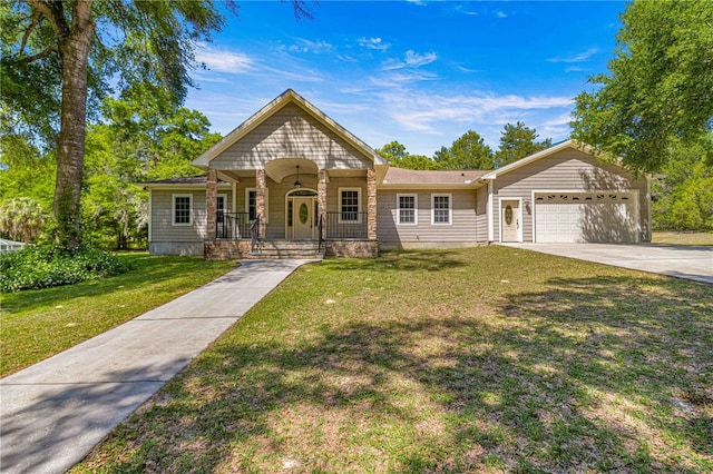 view of front facade with a porch, a garage, and a front yard