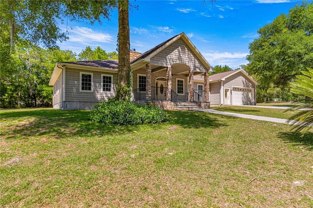 view of front facade with a garage, covered porch, and a front yard