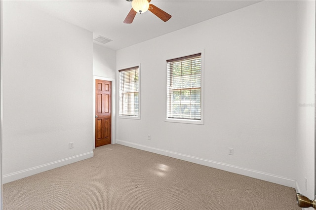 carpeted empty room with ceiling fan