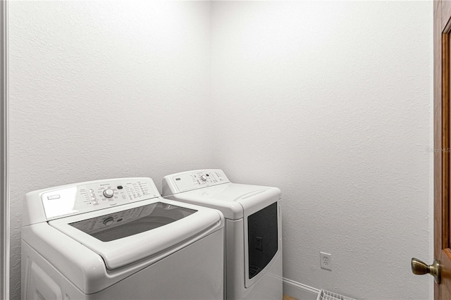 laundry room with washer and dryer