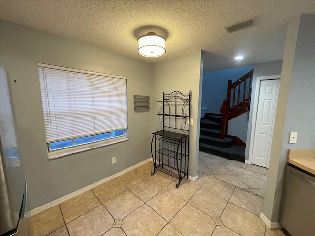 interior space featuring a textured ceiling