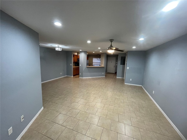 unfurnished living room featuring ceiling fan