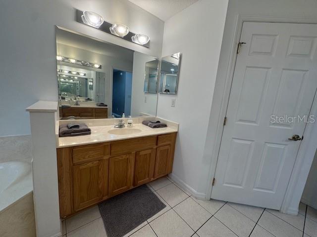 bathroom featuring vanity and tile patterned floors