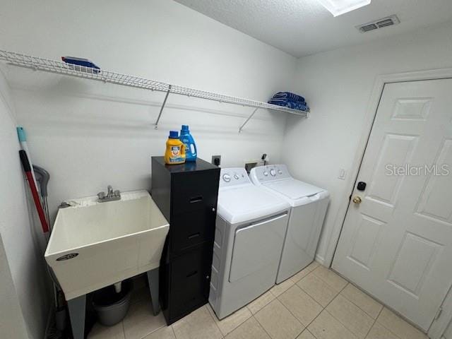 laundry area with washing machine and dryer