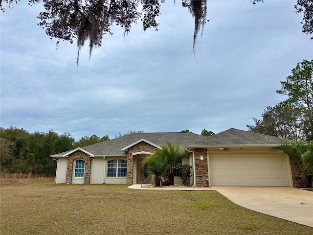 single story home featuring a garage and a front lawn