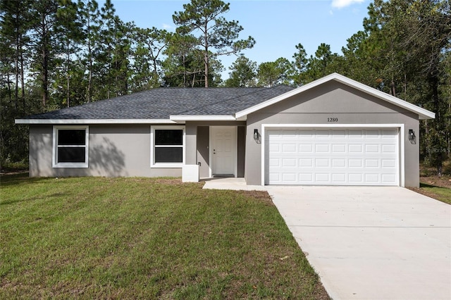 ranch-style house with a front yard and a garage