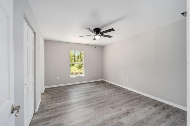 unfurnished bedroom featuring ceiling fan and wood-type flooring