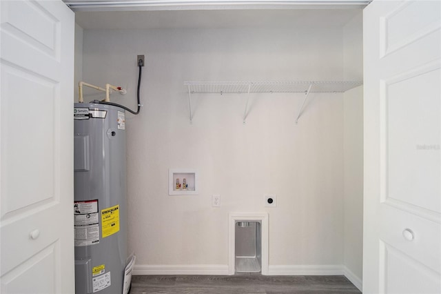 clothes washing area featuring hardwood / wood-style floors, hookup for an electric dryer, hookup for a washing machine, and water heater