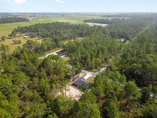 birds eye view of property with a rural view