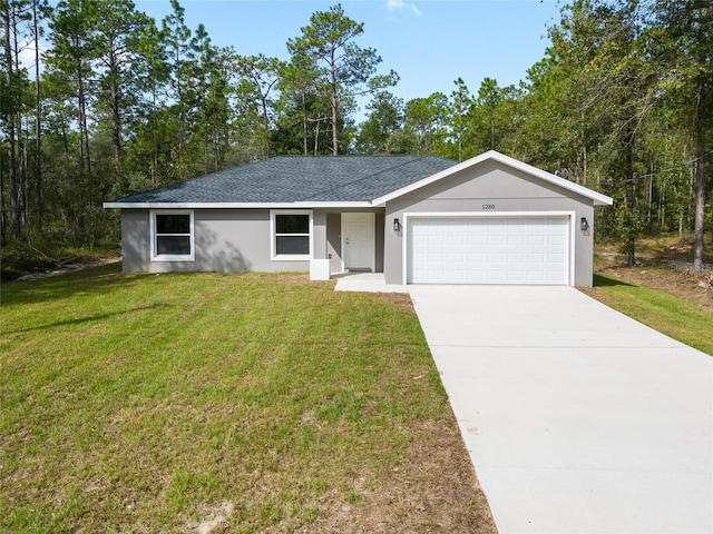 single story home featuring a front lawn and a garage