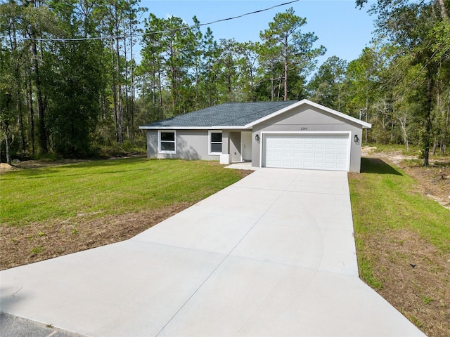 single story home with a front yard and a garage