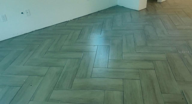 interior details featuring parquet flooring