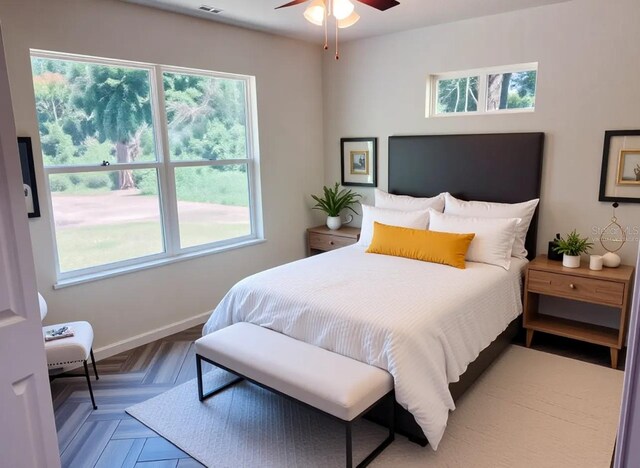 bedroom featuring baseboards and visible vents