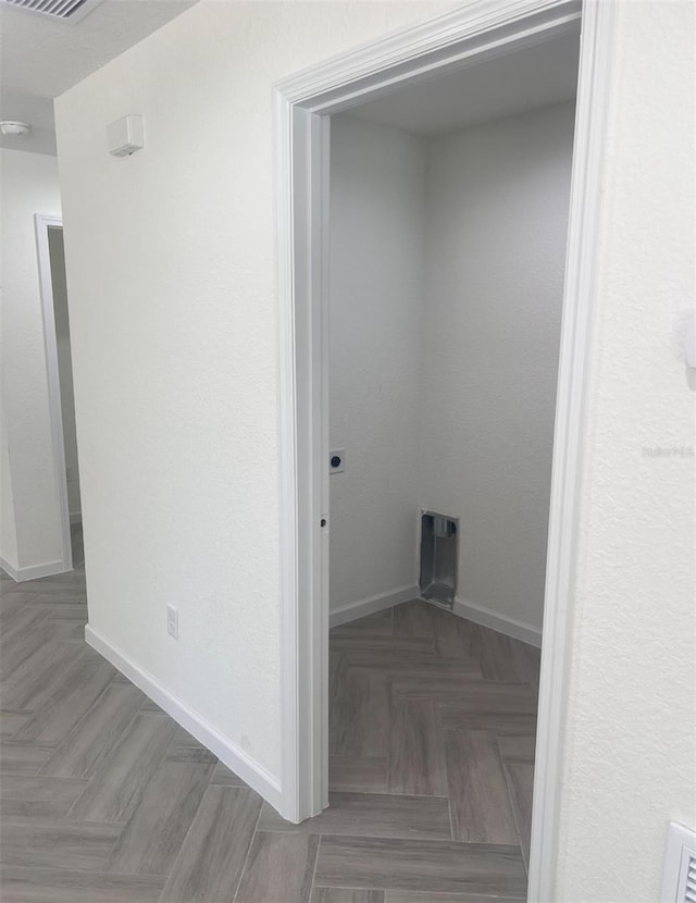 washroom with baseboards and visible vents