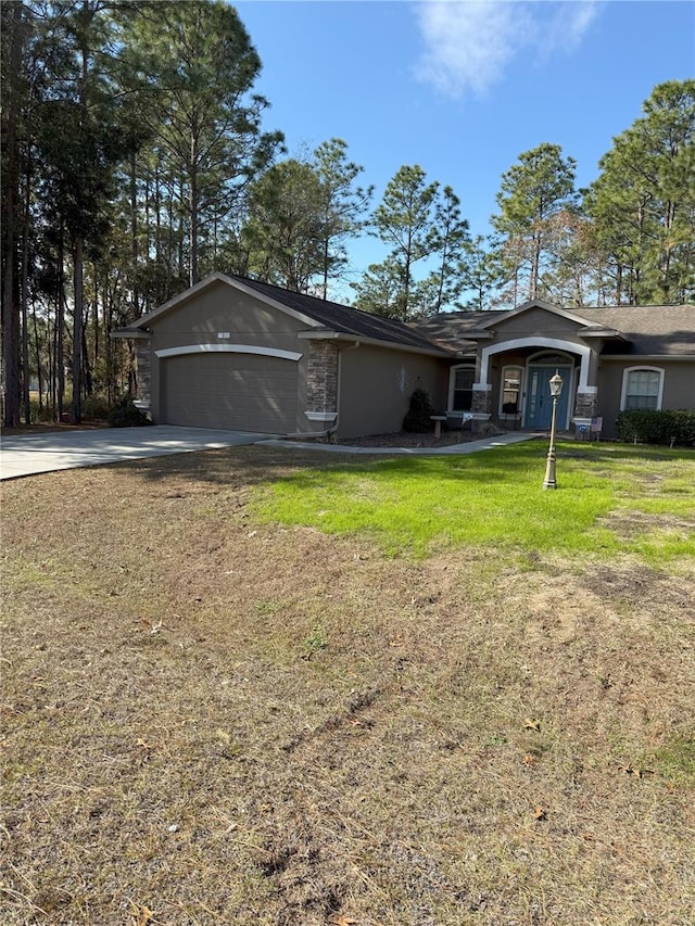 ranch-style house featuring a garage and a front lawn