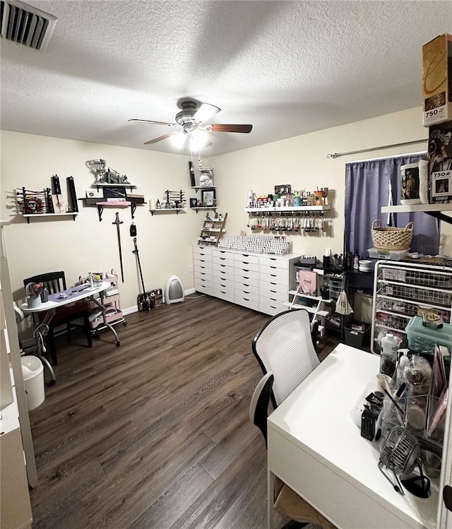 office area featuring a textured ceiling, ceiling fan, and dark hardwood / wood-style flooring