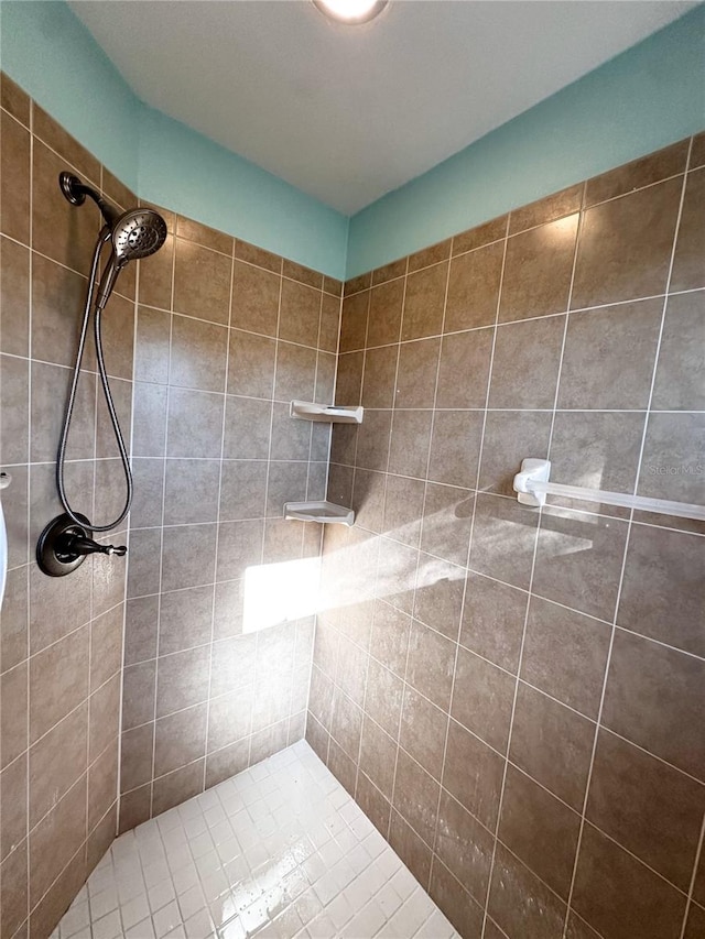 bathroom with a tile shower