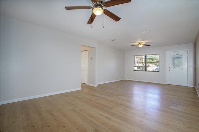 spare room featuring ceiling fan and light wood-type flooring