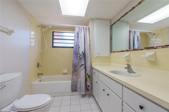 full bathroom with shower / bath combo, vanity, backsplash, tile patterned floors, and toilet