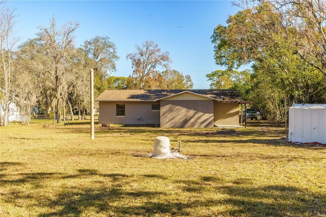 view of side of home featuring a lawn