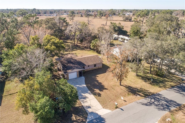 birds eye view of property with a rural view