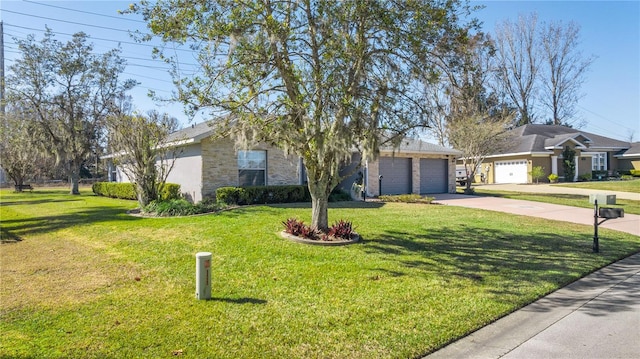 ranch-style home with a garage and a front lawn