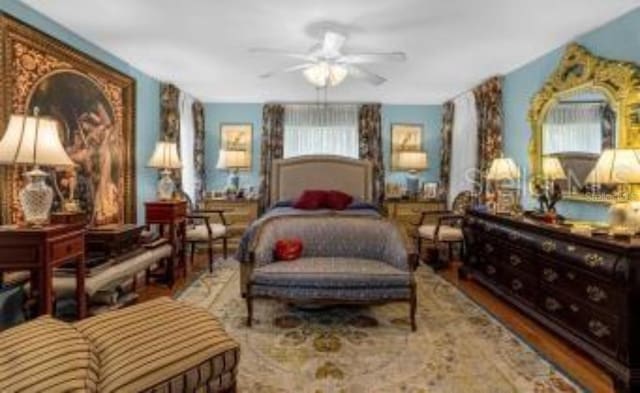 bedroom featuring hardwood / wood-style flooring and ceiling fan