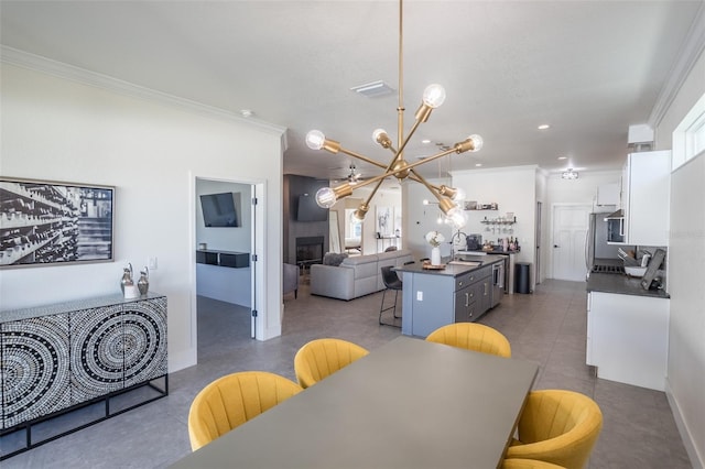 dining area with a chandelier and ornamental molding