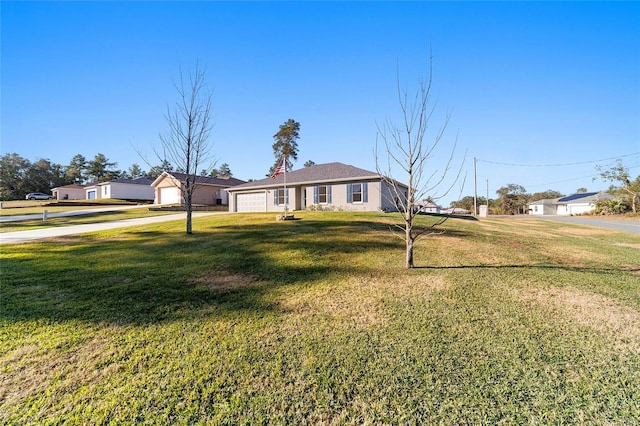 ranch-style house with a front yard and a garage