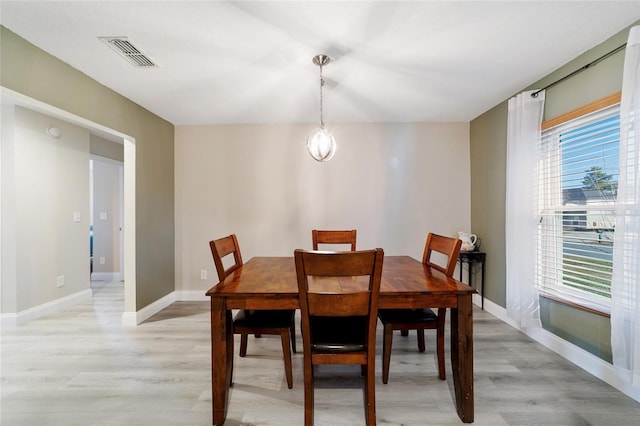 dining area featuring light wood-type flooring