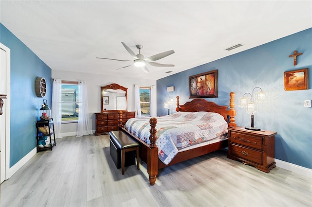 bedroom with light wood-type flooring and ceiling fan