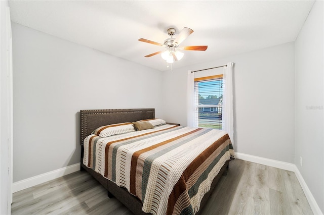 bedroom featuring ceiling fan and light wood-type flooring