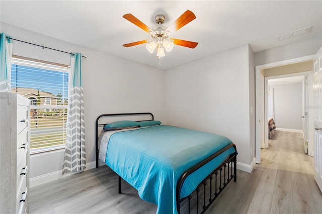 bedroom featuring ceiling fan and light hardwood / wood-style floors