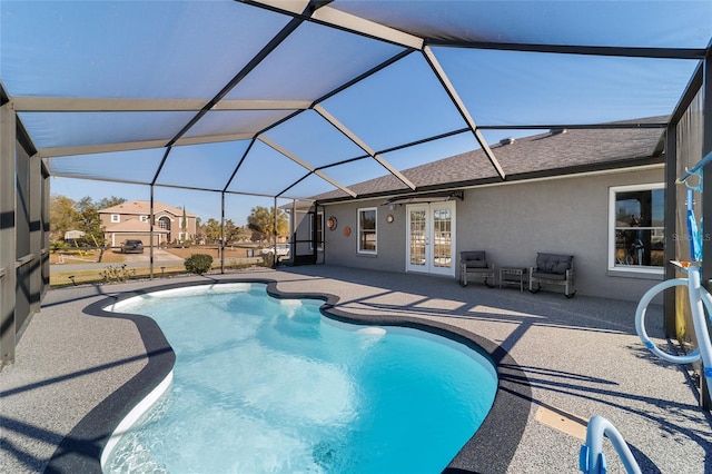 view of swimming pool featuring french doors, glass enclosure, and a patio