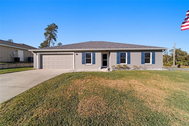 ranch-style home featuring a front lawn and a garage