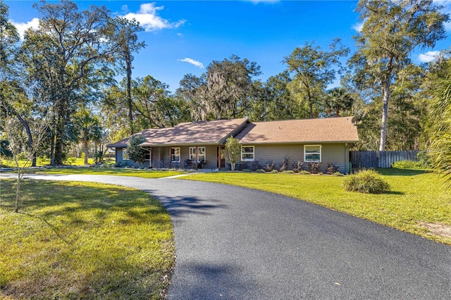 single story home with a front yard