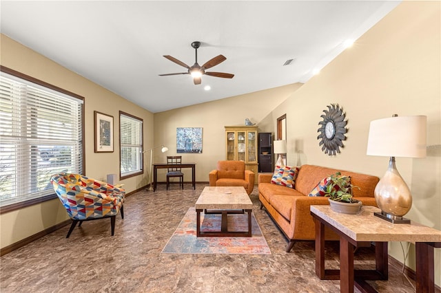 living room with ceiling fan and vaulted ceiling