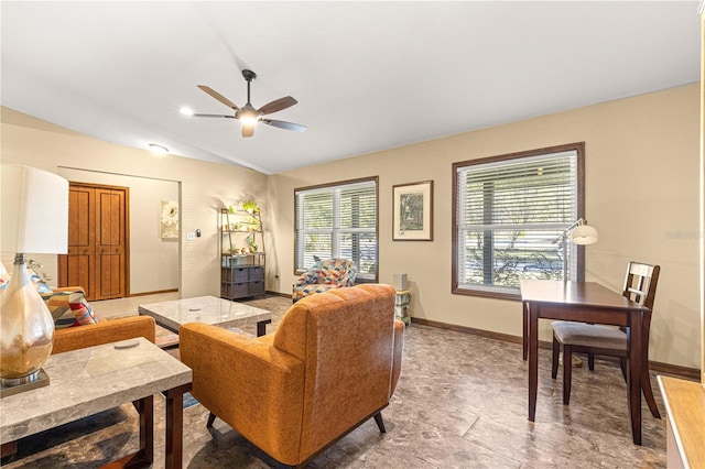 living room with lofted ceiling and ceiling fan