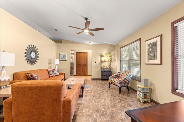 living room featuring ceiling fan and vaulted ceiling