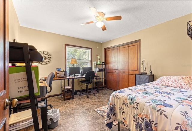 bedroom with ceiling fan, a closet, and a textured ceiling