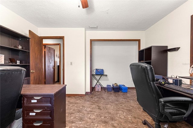 home office featuring a textured ceiling and ceiling fan